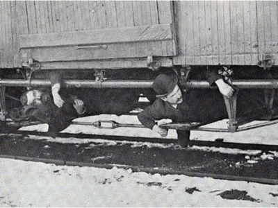 Two-hobos-hiding-under-a-boxcar-in-snowy-conditions-in-1894.-Wikimedia-Commons-.png