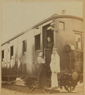 Eleanor Pray and Sarah Smith posed with their friend Mr. Hunt at a Trans-Siberian railroad car wh.jpg