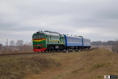 Тепловоз М62-1528 с вагонами следует по перегону Осовец - Кричев-I, Могилёвская обл.<br />Автор: Игорь | Фото сделано 16.III.2016.